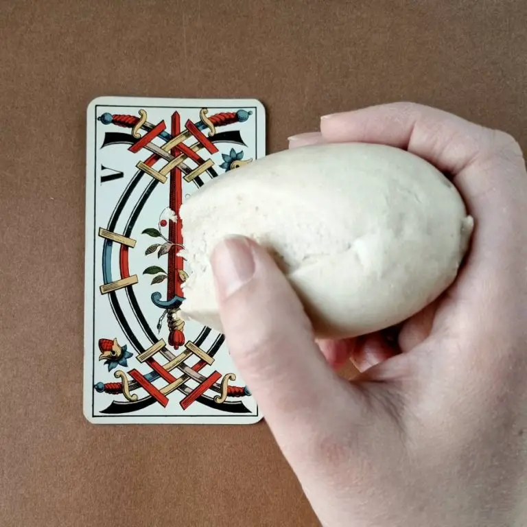 Use white bread to polish a dirty tarot card.